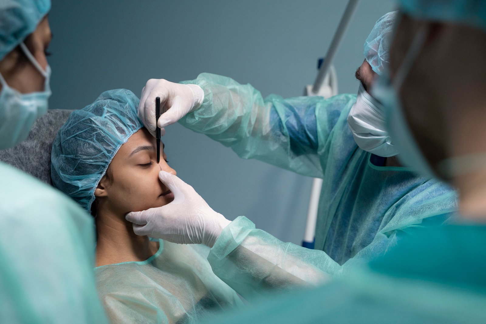 side-view-doctor-checking-patient-before-rhinoplasty